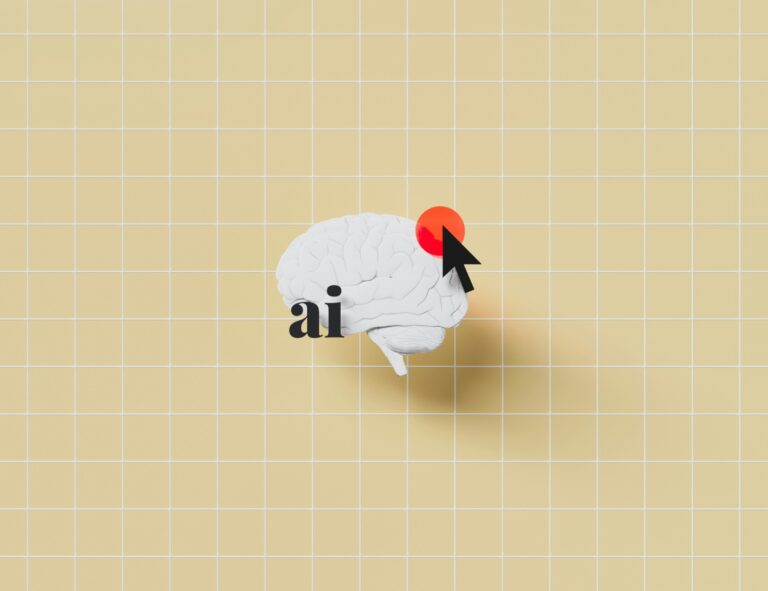 A white brain model with a cursor and the letters ai on a yellow grid
