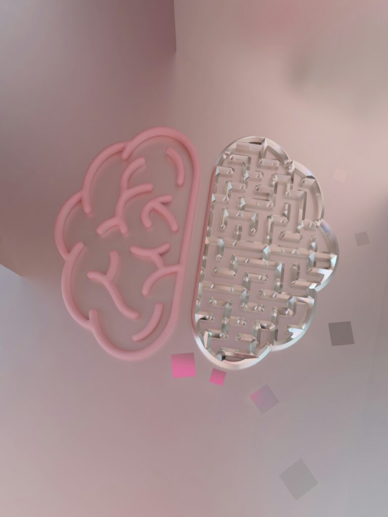 A pink brain outline beside a maze shaped like the other half of a brain