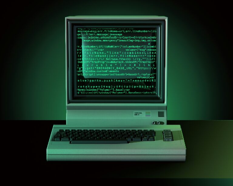 A retro computer displaying lines of green code