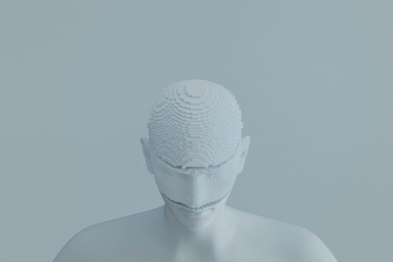 A white mannequin wearing a white mask
